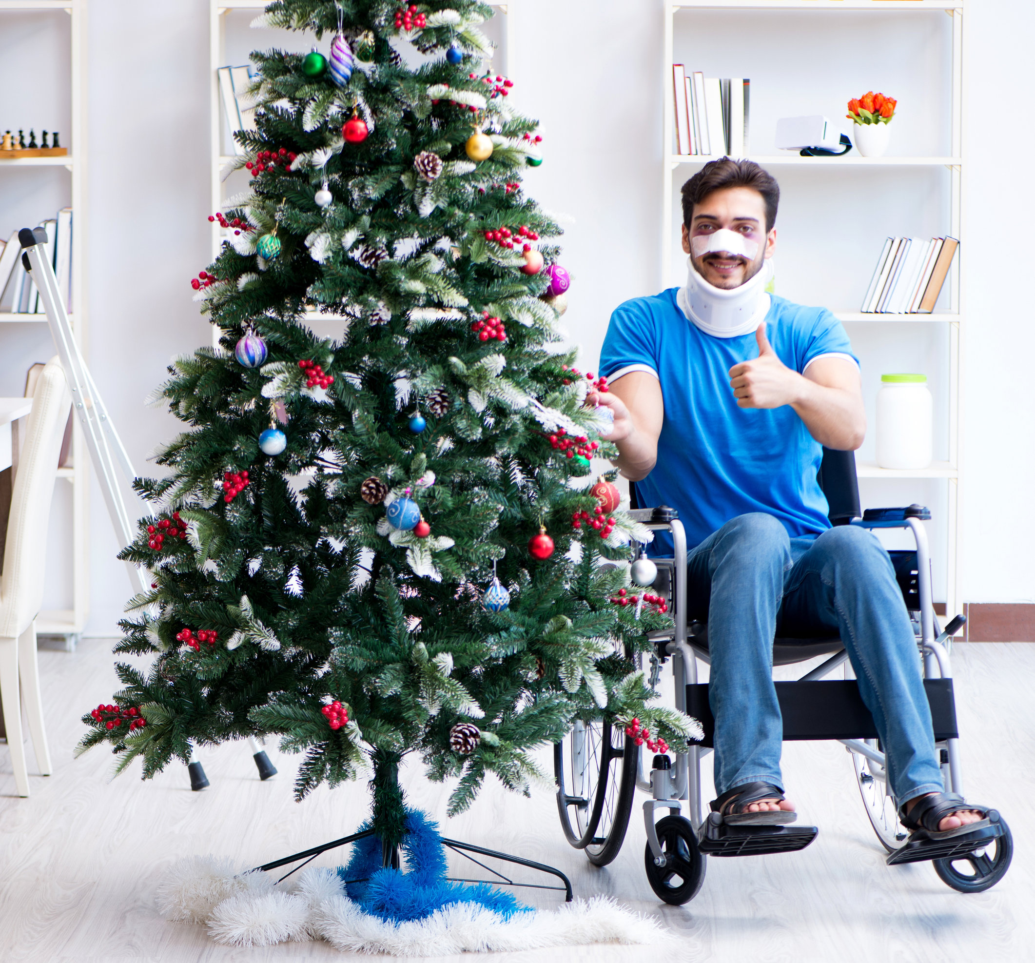 injured man with Christmas tree